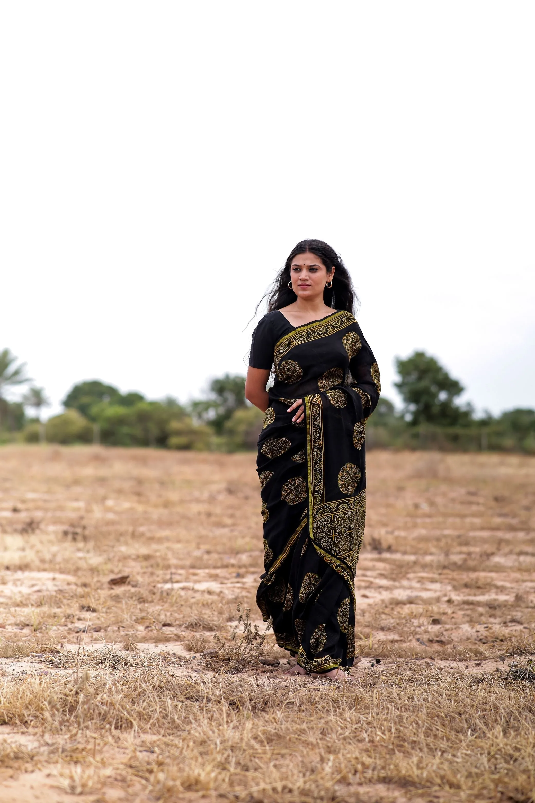 Jharokha -Black and green floral silk cotton Ajrakh handblockprinted saree